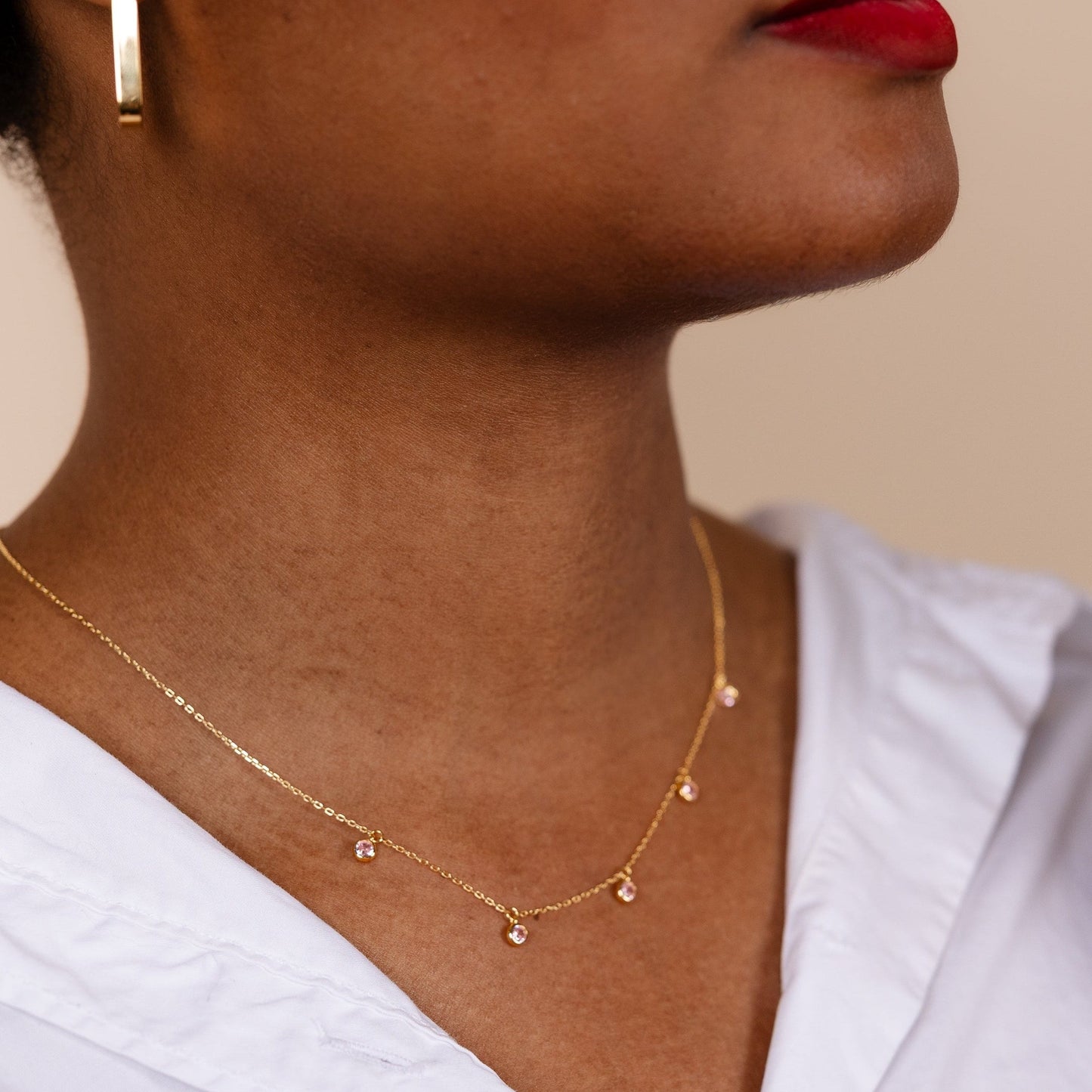 Minimalist 14k gold plated sterling silver drop necklace with light pink cubic zirconia bezels