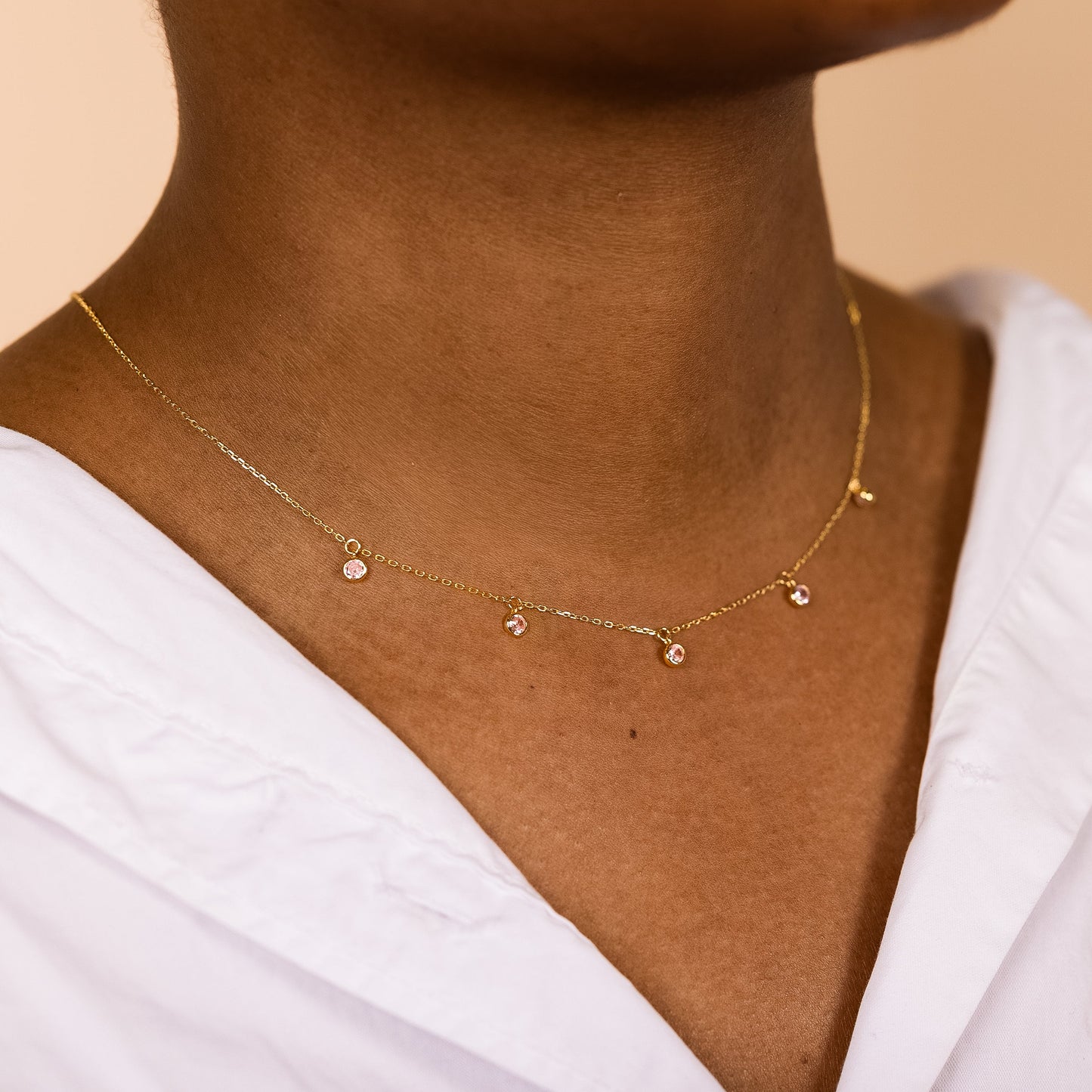 Minimalist 14k gold plated sterling silver drop necklace with light pink cubic zirconia bezels